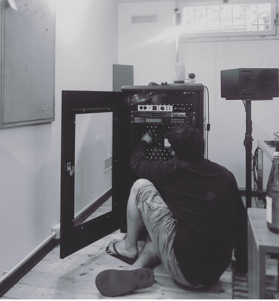 Emanuele Frusi composing a film score in his studio